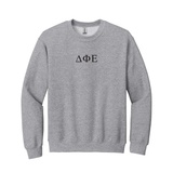 Represent your Delta Phi Epsilon sisterhood with integrity in this timeless appeal Gildan crewneck sweatshirt. It showcases your esteemed ΔΦΕ Greek letters expertly embroidered on the center chest.